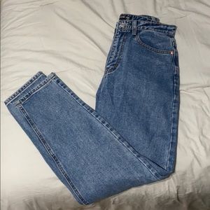 Mom jeans with a cute rip in the butt. Brand is pretty little thing.